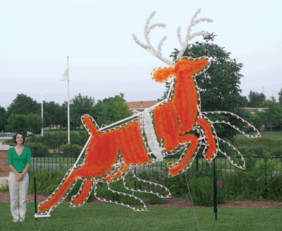 Daytime view, giant commercial-grade animated outdoor Christmas holiday reindeer, Santa sleigh, C7 LED, aluminum frame, Dasher, Dancer, Prancer, Vixen, Comet, Cupid, Dunder (variously spelled Donder and Donner), and Blixem (variously spelled Blixen and Blitzen